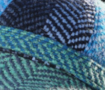 Close-up of a textured fabric with blue and green patterns
